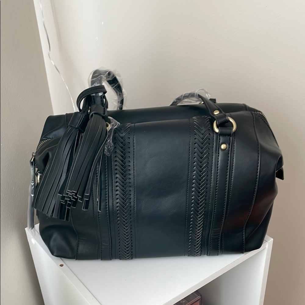 Francesca's Collections Black Travel Bag with Tassel Charm